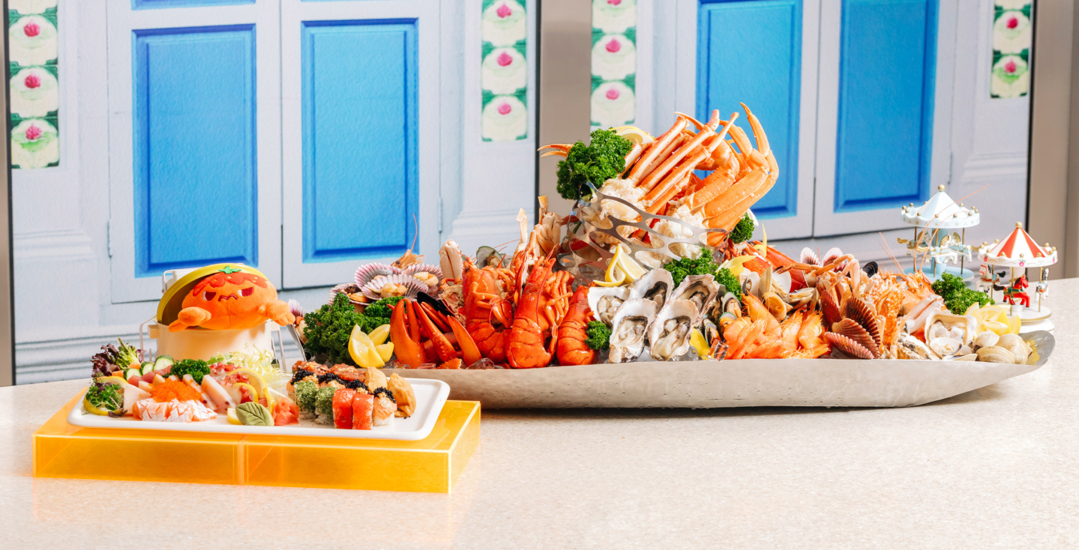 Platter of seafood - lobsters, prawns, oysters, crab, scallop, crayfish - and platter of sushi from Carousel Buffet Restaurant Singapore